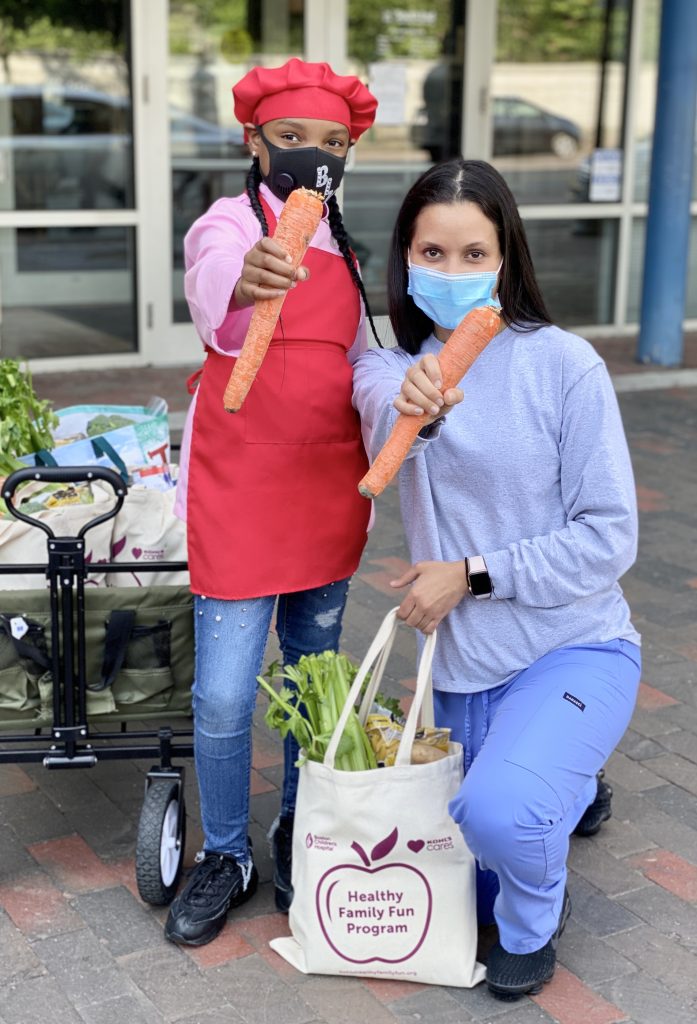 Paloma Suarez and a youth volunteer.