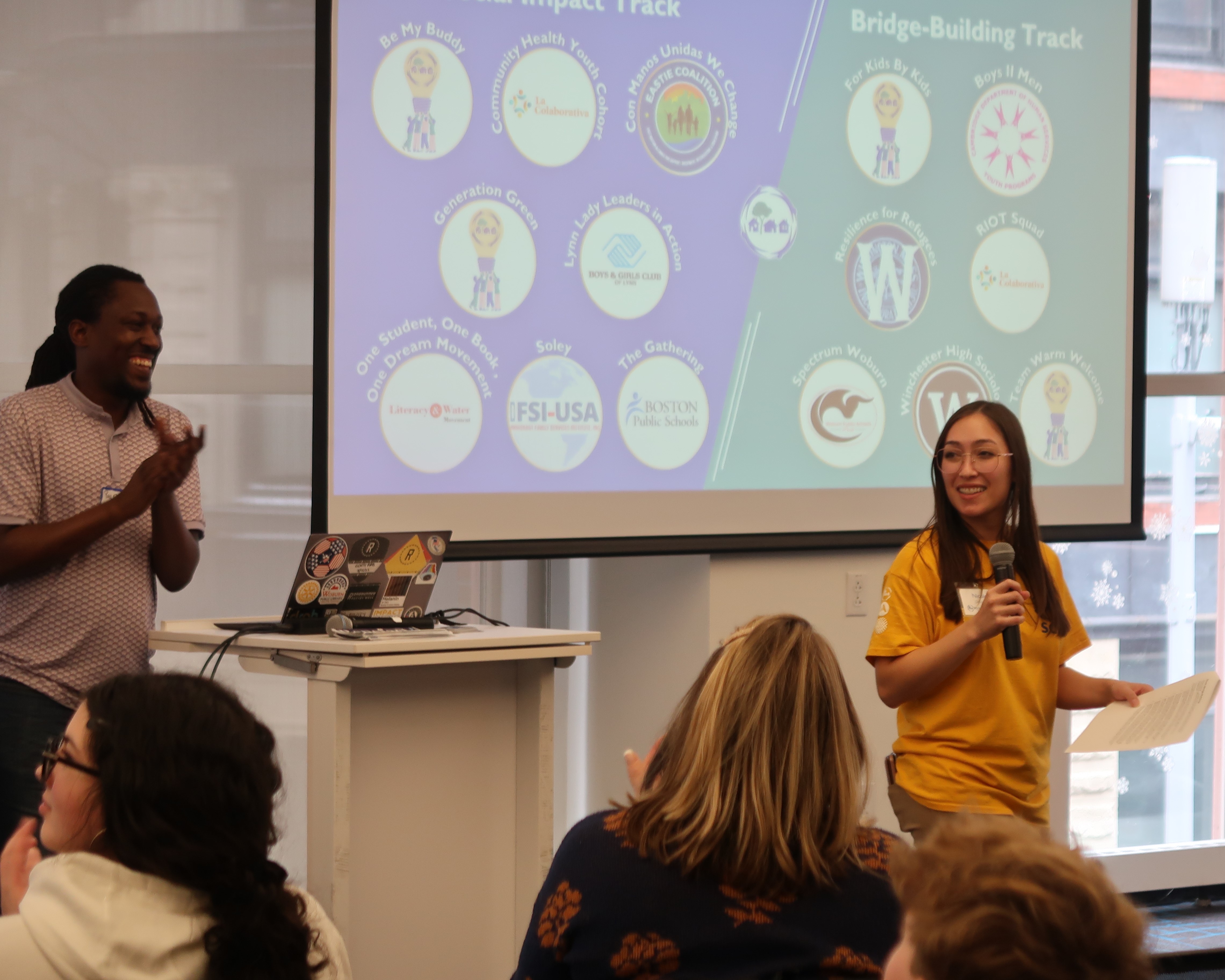 SCI Deputy Director Philip Gordon (left) and SCI Program Manager Nicole Osborne (right) welcome participating teams in the 2025 SCI Youth Grant Pitch Contest.