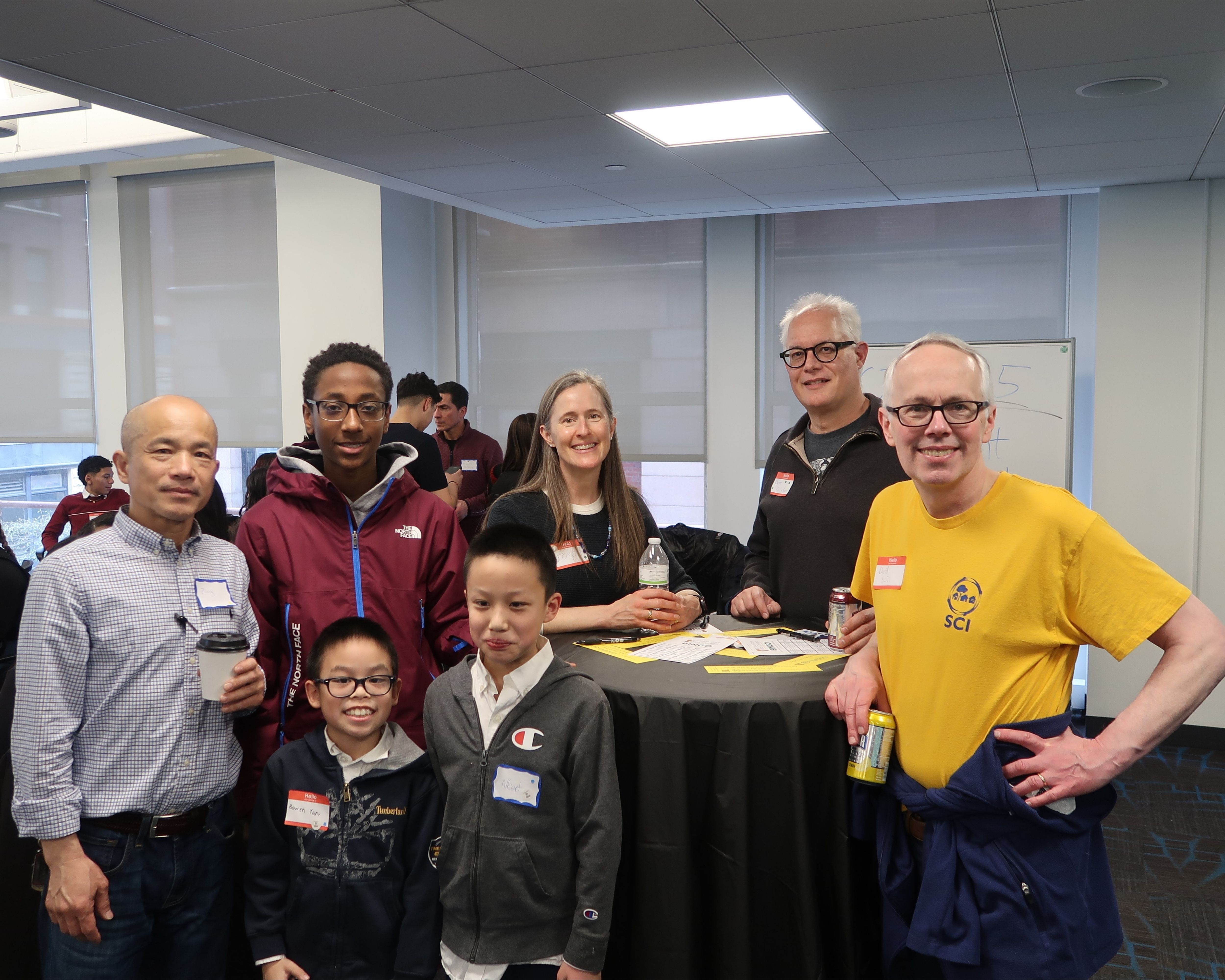 SCI President David Crowley (far right); Byron DeLaBarre, volunteer Pitch Coach (second from right); and Joyce Vyriotes, volunteer Pitch Coach and President of the Cummings Foundation (middle) pose with youth participants from Generation Green (Malden) and Be My Buddy (Revere).