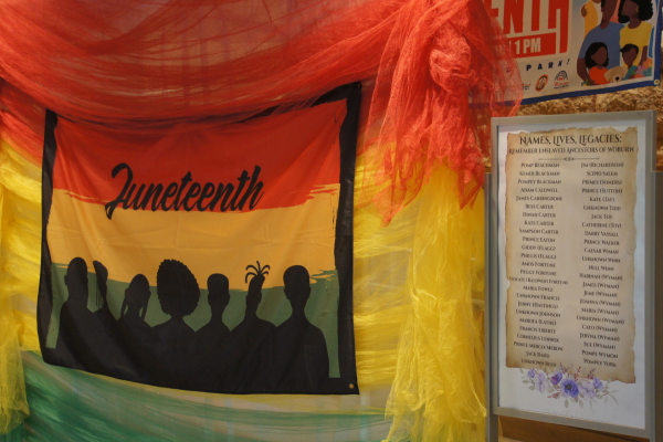 Decorations inside the library, including a list of former enslaved residents of Woburn, at Woburn Juneteenth 2025